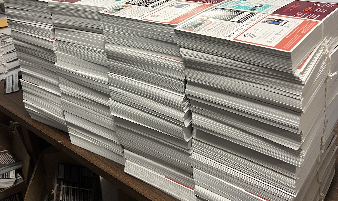 Stacks of printed postcards ready for delivery